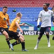 Bolton Wanderers' Paris Maghoma passes the ball to set up the second goal scored by Aaron Collins