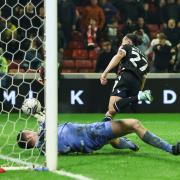 Randell Williams races away after scoring a 98th minute equaliser at Barnsley