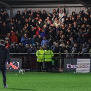 Ian Evatt applauds the supporters after a game at Fleetwood in late December