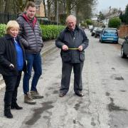 Cllr John Walsh examining potholes in early 2023 with Cllr Hilary Fairclough and the then Cllr Samuel Rimmer
