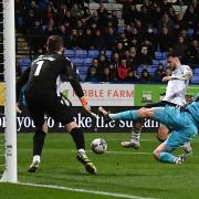 Aaron Collins slots home against Oxford