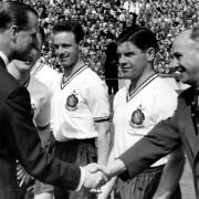 Prince Philip meets Bolton Wanderers players Ray Parry, Tommy Banks and team manager Bill Ridding, before the 2-0 victory over Manchester United in the 1958 FA Cup Final