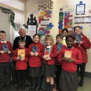 Schoolreader Dave McGee with the children he reads with