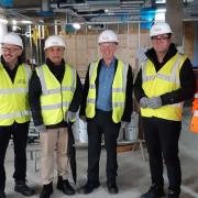 Andy Burnham with Cllr Nick Peel, Cllr Akhtar Zaman and Keith Edwards of Clear Future