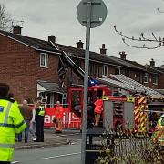 The scene at Flappers Fold Lane in Atherton where a crane has fallen on a house