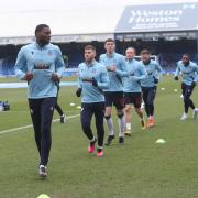 Bolton Wanderers' players warm up for their game at Peterborough United last season