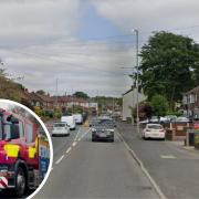Mum and child taken to safety after car caught fire