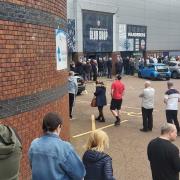 Bolton Wanderers fans queue outside the Ticket Office for the play-off semi-final against Barnsley