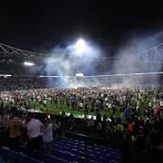 Bolton Wanderers fans poured on to the pitch after the final whistle