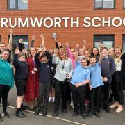 Staff and pupils at Rumworth School celebrating the Ofsted rating