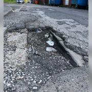 Potholes on Penrose Street in Tonge Fold