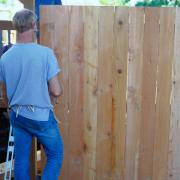 If you own the fence and it is within your boundary your neighbour is not allowed to move it or take it down.