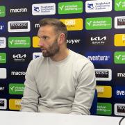 Wanderers boss Ian Evatt speaks to the media