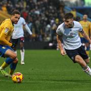 Thomason drives with the ball