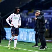 Bolton Wanderers manager Steven Schumacher talks to Ibrahim Cissoko during a break in play