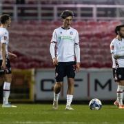 Eoin Toal , Joel Randall and Josh Sheehan look sheepish after the FA Cup defeat at Swindon Town