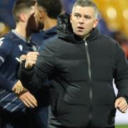 Steven Schumacher celebrates Wanderers' second away win of the season at Mansfield