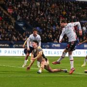 Bolton Wanderers' Max Conway shoots for goal under pressure from Rotherham United's Joe Powell