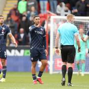 Bolton Wanderers players remonstrate with referee James Oldham after Rotherham United opened the scoring