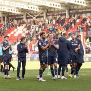 Bolton Wanderers players applaud the travelling fans at the final whistle