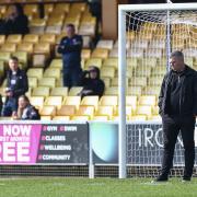 Steven Schumacher takes a look at the Port Vale pitch before Saturday's game
