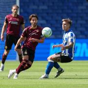 Bolton Wanderers' Josh Sheehan passes the ball under pressure from Sheffield Wednesday's Jarvis Thornton
