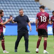 Josh Sheehan shakes hands with Steven Schumacher at the end of the Sheffield Wednesday game