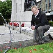 Cllr Christopher Peacock at the war memorial in Victoria Square, where his grandmother's poppy wreath was stolen