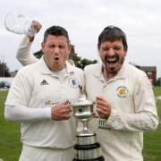 Christian Walsh and Matt Parkinson celebrate with the Anthony Axford Bolton League trophy