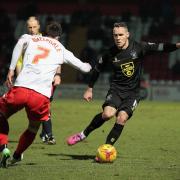 Bury's Chris Hussey, right, in action at Stevenage on Tuesday night