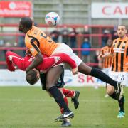 LET'S GET PHYSICAL: Robust challenges from the Altrincham v Barnet game last Saturday
