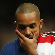 Theo Walcott looks dejected after Arsenal exited the Champions League - but should we sympathise with plucky losers?