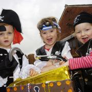 From left, Felix Delvard-McNeil, Freya Swailes and Lily Rothwell, all aged three, dress up as pirates at North House Nursery