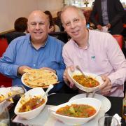 Luis Troyano with Mike Harrison try the Bolti at the Royal Balti House