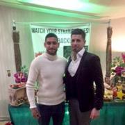 HOME: Amir Khan at The New Dhanak Deira, Blackburn Road, Bolton with owner Omar Shahid