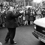Father William Doran, Chaplain of Mount St Joseph School, Bolton, blessing the school's new minibus