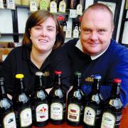 BOTTLED RANGE: Staff member Jennifer Burrows and brewery owner Dave Sweeney