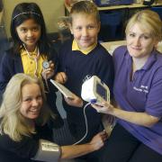 VITAL LESSONS: SS Osmund and Andrew RC Primary School pupils Deanne Marquez, aged nine, and Daniel Lucan, aged eight help NHS health trainer Petra Ser