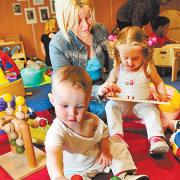 PLAY TIME: Amy Mulvaney with her children, Kayden and Lela, at the Orchards Children’s Centre in Farnworth