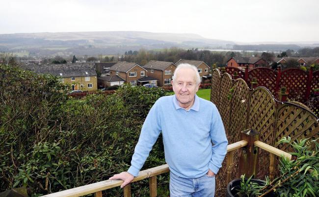 Brian Caswell enjoying the view from his new home on the outskirts of Bolton