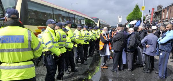 Police lined up in front of counter-protesters as the North West Infidels held a demonstration in Blackburn Road