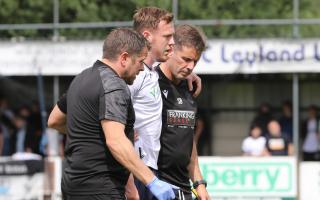 George Johnston is helped from the field after his injury against Bamber Bridge in pre-season