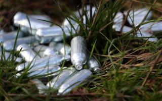 EMBARGOED TO 0001 WEDNESDAY OCTOBER 18 File photo dated 13/01/2023 of a view of canisters of nitrous oxide, or laughing gas, discarded by the side of a road near Ebbsfleet, Kent. Laughing gas will become illegal in November, with dealers facing up to 14