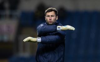 Bolton Wanderers keeper Nathan Baxter in the warm-up at Oxford United