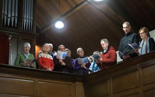 Carols by candlelight at Walmsley Unitarian Chapel. Picture by Henry Lisowski