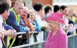NO BARRIER: The Queen chats with bakery workers outside the Warburtons factory