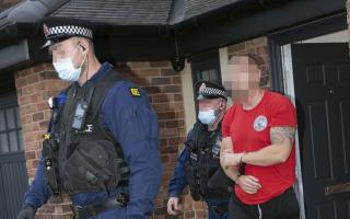 Officers attending an address in Bury and arresting a suspect as part of drugs raids across the country
