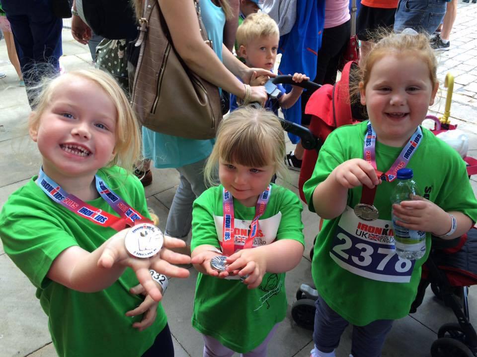 Four-year-old Holly Barnes, three-year-old Evie Barnes and four-year-old Rhianwen Parkinson showing off their medals.