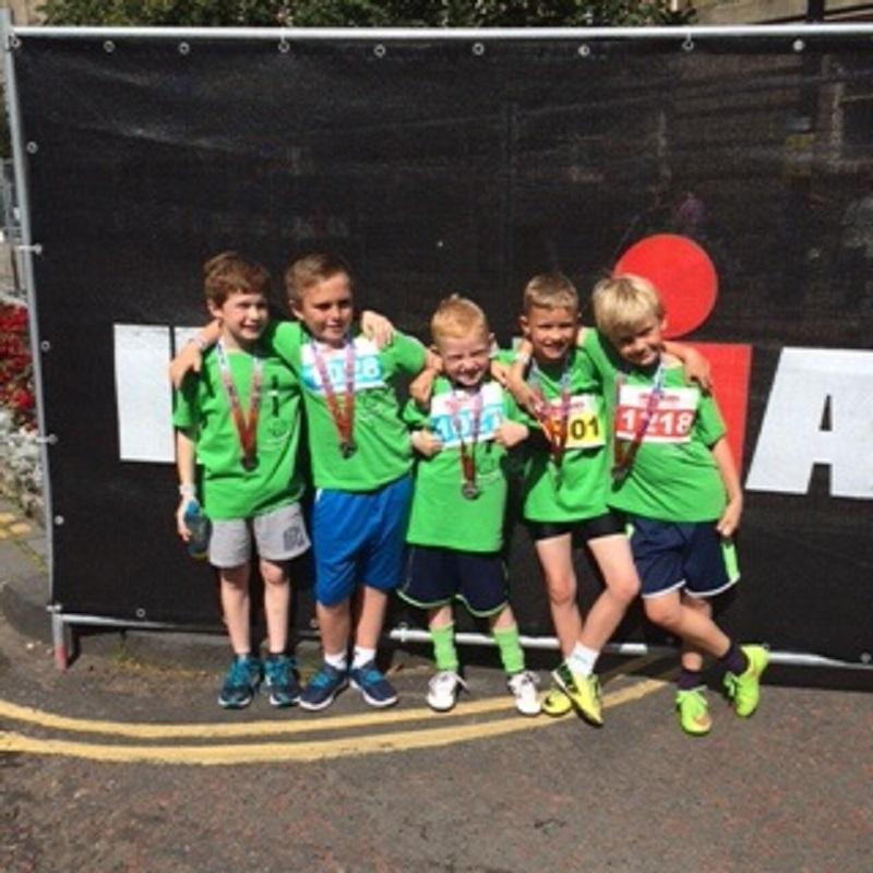 Teammates from Moss Bank Football green team after the race.