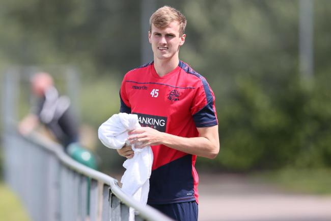 Rob Holding on pre-season tour with Wanderers, is being chased by Arsenal and Bournemouth